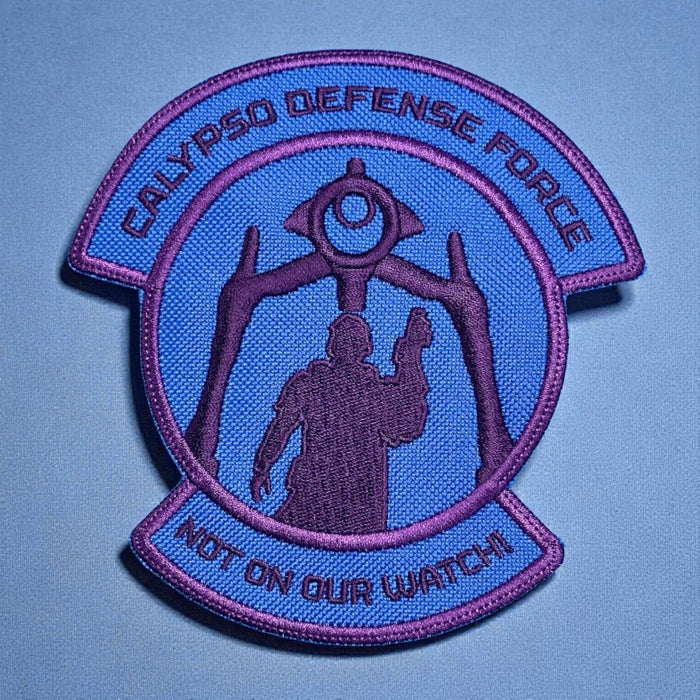 Purple and blue “Calypso Defense Force” patch with a soldier silhouette and robot figure.