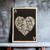 Ace of Hearts embroidered patch with gold ornamental heart on black, 3x4 inches, sew-on, iron-on, or hook backing.