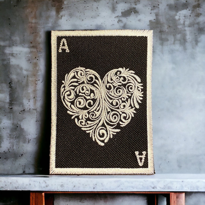 Ace of Hearts embroidered patch with gold ornamental heart on black, 3x4 inches, sew-on, iron-on, or hook backing.