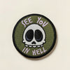 My Threaded Heart embroidered patch with a green background, featuring a white skull with black eyes and purple text saying "See You In Hell".
